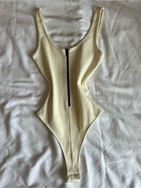Naked Wardrobe Ribbed Scoop Neck Bodysuit in Cream with Front Zip